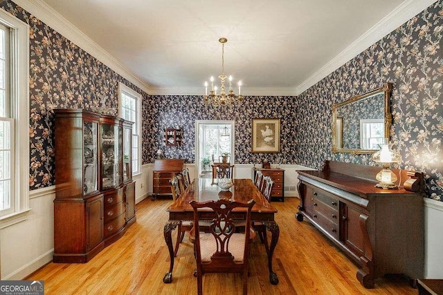 835 Timothy Rd, Athens, GA 30606 - dining space with plenty of natural light, an inviting chandelier, wallpapered walls, and light wood-style flooring