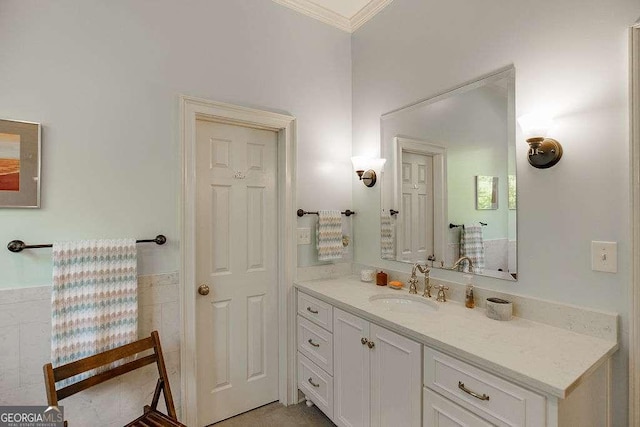 835 Timothy Rd, Athens, GA 30606 - bathroom with tile walls, crown molding, vanity, and wainscoting