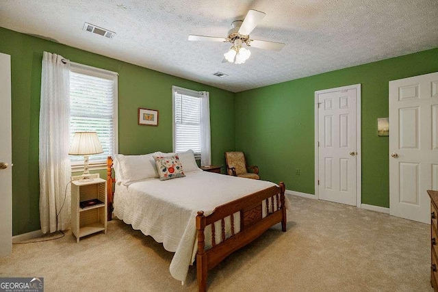 835 Timothy Rd, Athens, GA 30606 - bedroom with light colored carpet, a textured ceiling, and visible vents