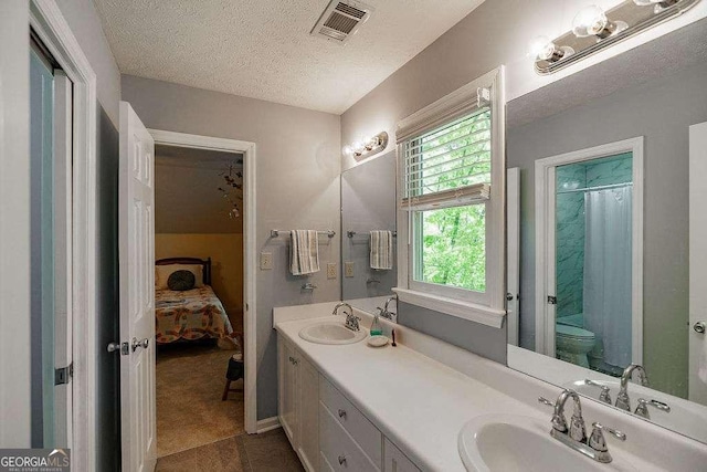 835 Timothy Rd, Athens, GA 30606 - full bath featuring visible vents, a textured ceiling, a sink, and toilet