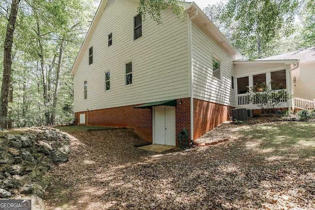 835 Timothy Rd, Athens, GA 30606 - view of side of property featuring a sunroom, brick siding, and cooling unit