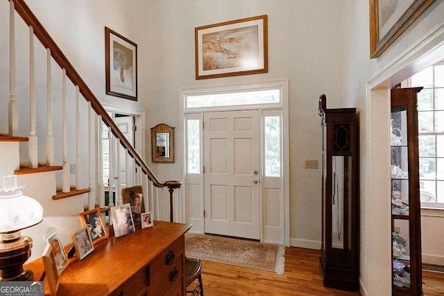 835 Timothy Rd, Athens, GA 30606 - foyer entrance with wood finished floors, a high ceiling, and a wealth of natural light