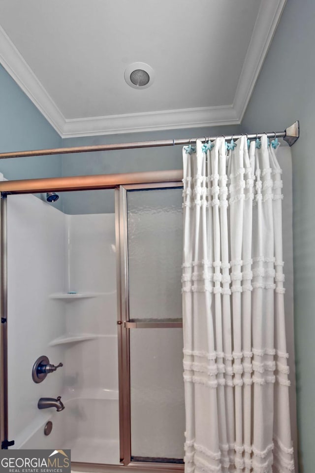 bathroom featuring ornamental molding and tub / shower combination