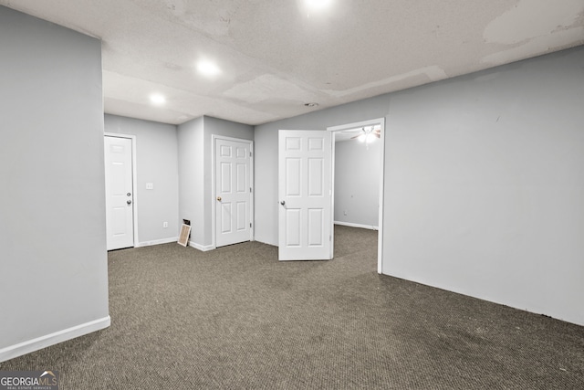 basement with baseboards, carpet floors, and recessed lighting
