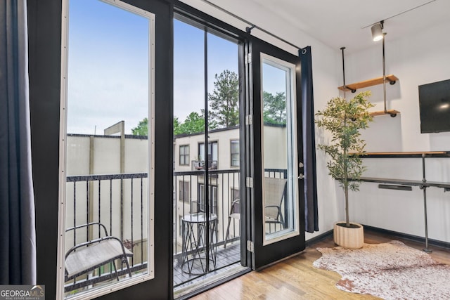 5300 Peachtree Rd Unit 3601, Atlanta, GA 30341 - doorway to outside with wood finished floors and rail lighting