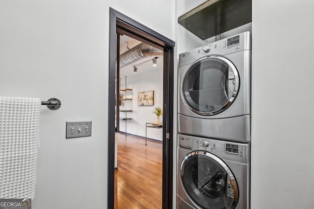 5300 Peachtree Rd Unit 3601, Atlanta, GA 30341 - laundry room featuring stacked washer / dryer and wood finished floors