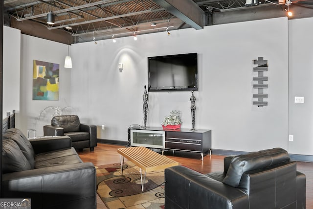 5300 Peachtree Rd Unit 3601, Atlanta, GA 30341 - living area with baseboards, a high ceiling, wood finished floors, and rail lighting