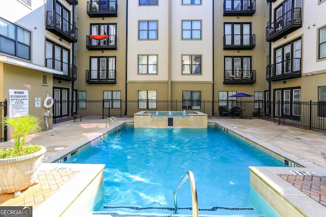5300 Peachtree Rd Unit 3601, Atlanta, GA 30341 - view of swimming pool featuring a pool with connected hot tub