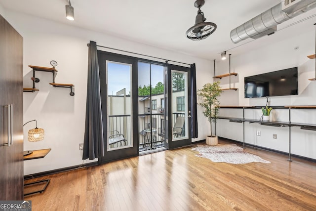 5300 Peachtree Rd Unit 3601, Atlanta, GA 30341 - doorway with wood-type flooring and baseboards
