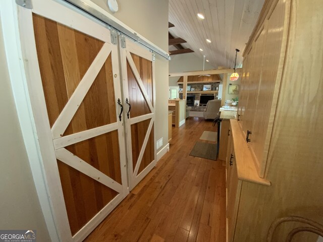 522 Satsuma Ct S, Ellijay, GA 30540 - corridor with hardwood / wood-style flooring, wooden ceiling, a barn door, recessed lighting, and lofted ceiling