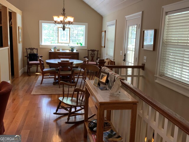 522 Satsuma Ct S, Ellijay, GA 30540 - dining area featuring vaulted ceiling, light wood-style flooring, and a chandelier