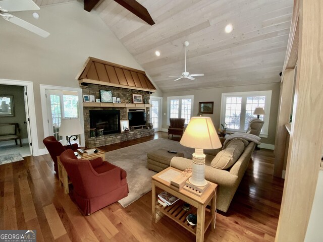 522 Satsuma Ct S, Ellijay, GA 30540 - living room featuring ceiling fan, high vaulted ceiling, beam ceiling, a stone fireplace, and wood finished floors