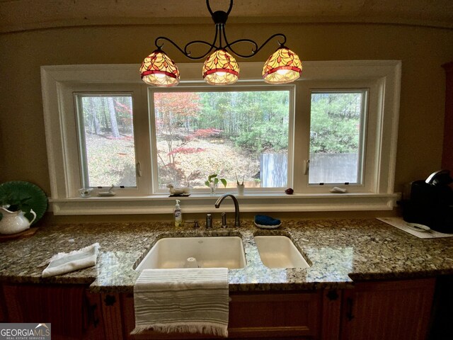 522 Satsuma Ct S, Ellijay, GA 30540 - kitchen with stone counters and decorative light fixtures
