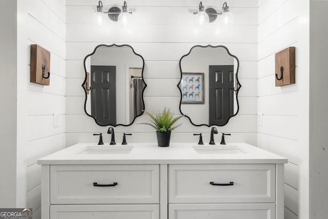 bathroom with double vanity and a sink