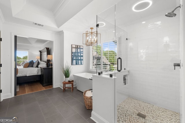 ensuite bathroom featuring a shower stall, a soaking tub, ensuite bath, ornamental molding, and visible vents