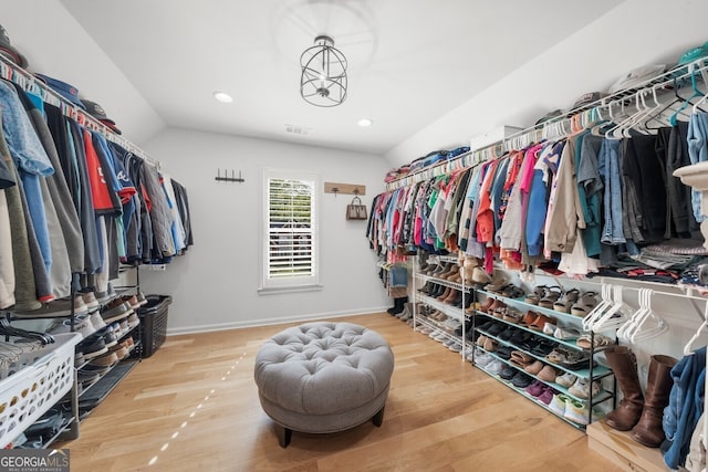 walk in closet with visible vents and wood finished floors