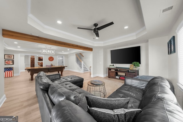 living area featuring a raised ceiling, visible vents, pool table, stairs, and ceiling fan