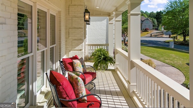 balcony featuring covered porch