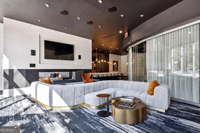living room featuring recessed lighting and a chandelier