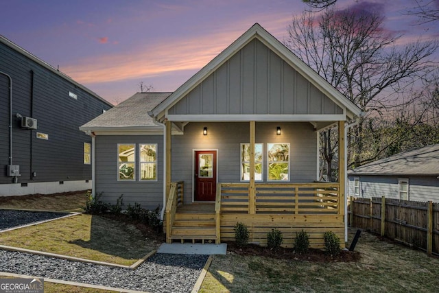 102 Dahlia Ave SW, Atlanta, GA 30314 - bungalow-style home with fence, covered porch, and board and batten siding
