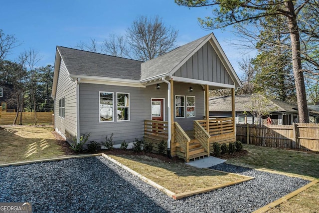 102 Dahlia Ave SW, Atlanta, GA 30314 - view of front of property with board and batten siding, a shingled roof, and fence