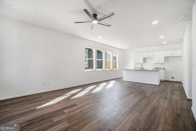 102 Dahlia Ave SW, Atlanta, GA 30314 - unfurnished living room with dark wood finished floors, recessed lighting, a ceiling fan, and a sink