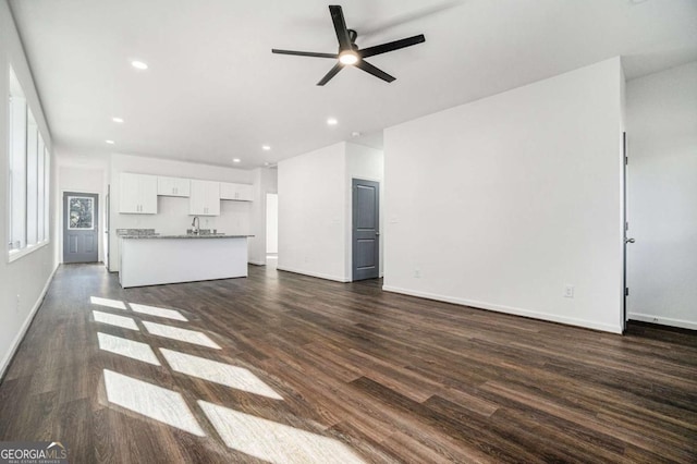 102 Dahlia Ave SW, Atlanta, GA 30314 - unfurnished living room with recessed lighting, a sink, dark wood-style flooring, a ceiling fan, and baseboards