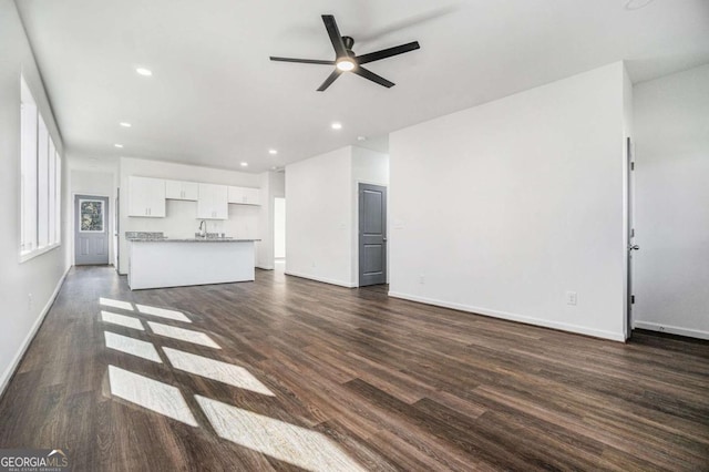 102 Dahlia Ave SW, Atlanta, GA 30314 - unfurnished living room with recessed lighting, a sink, dark wood-type flooring, baseboards, and ceiling fan