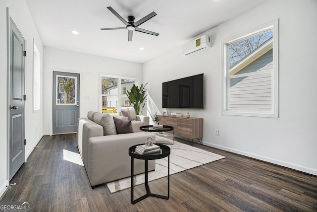 102 Dahlia Ave SW, Atlanta, GA 30314 - living room featuring a wall mounted air conditioner, plenty of natural light, a ceiling fan, and dark wood finished floors