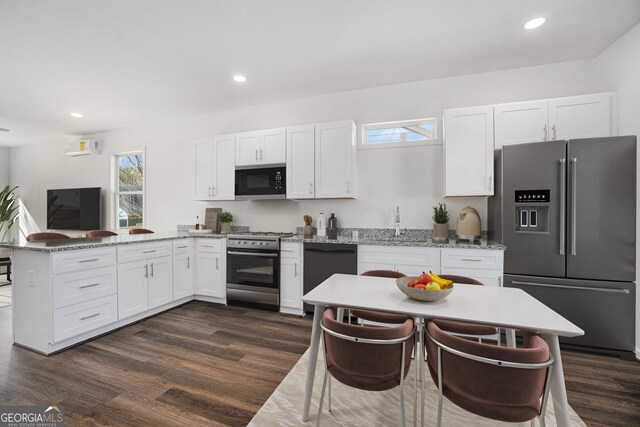 102 Dahlia Ave SW, Atlanta, GA 30314 - kitchen featuring white cabinetry, stainless steel appliances, and a healthy amount of sunlight