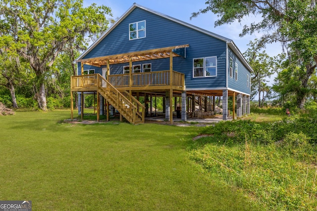 67 Bermuda Bluff Ln, Midway, GA 31320 - back of property with a wooden deck, a yard, and stairway