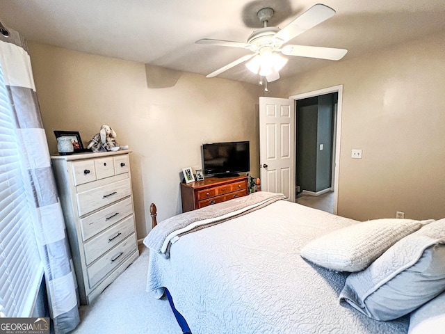 bedroom with light colored carpet and ceiling fan