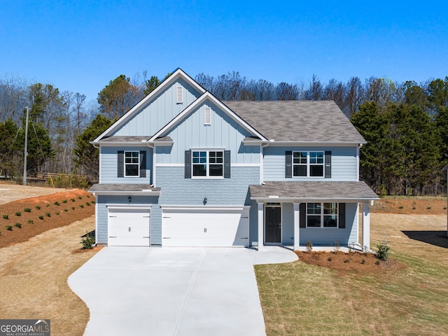 16 Virgil St, Dallas, GA 30132 - traditional-style home with covered porch, concrete driveway, an attached garage, board and batten siding, and a front yard