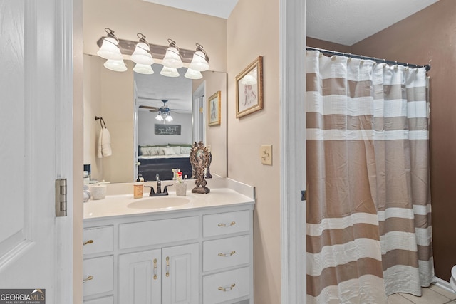 bathroom with ensuite bath, vanity, a shower with shower curtain, and ceiling fan