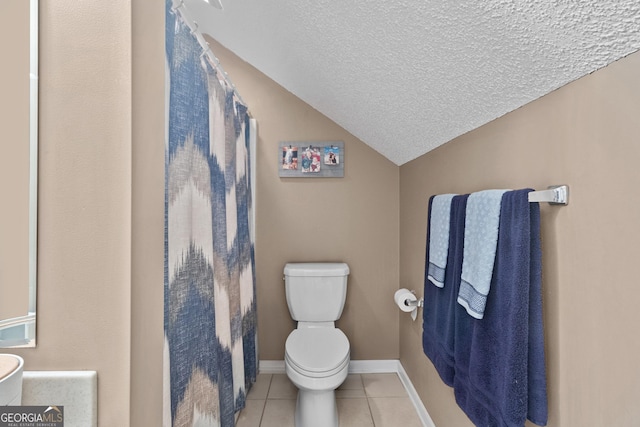 bathroom featuring tile patterned floors, vaulted ceiling, a textured ceiling, and toilet