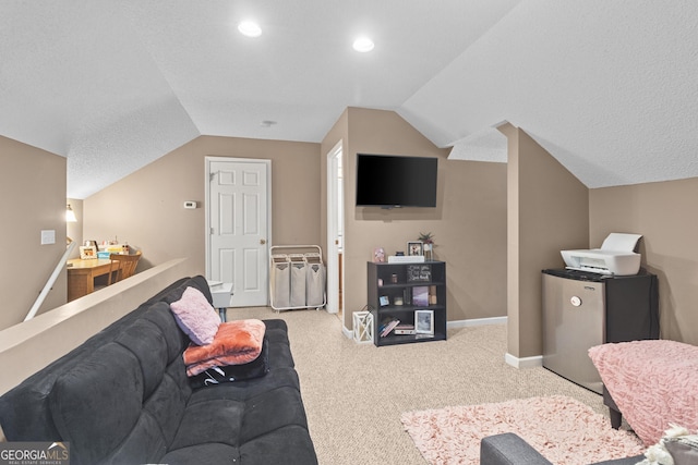living area featuring lofted ceiling, carpet floors, and baseboards