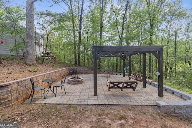 view of patio featuring a pergola and an outdoor fire pit