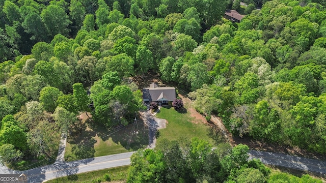 aerial view with a wooded view