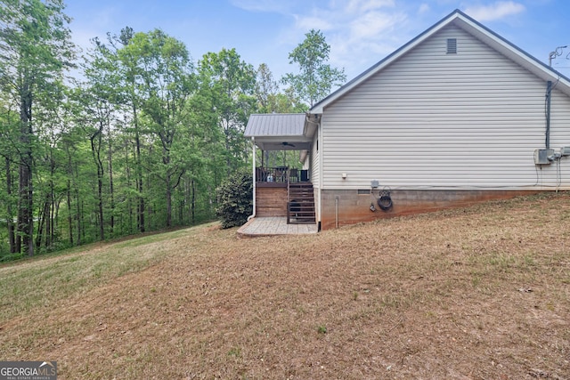 view of side of property with stairway and crawl space