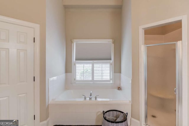 full bathroom with a garden tub and a stall shower