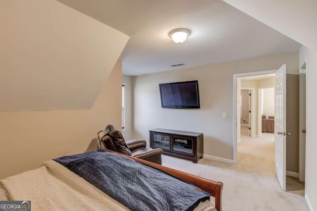 bedroom featuring light carpet, baseboards, and visible vents