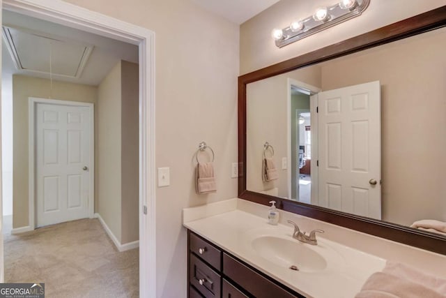 bathroom with baseboards and vanity