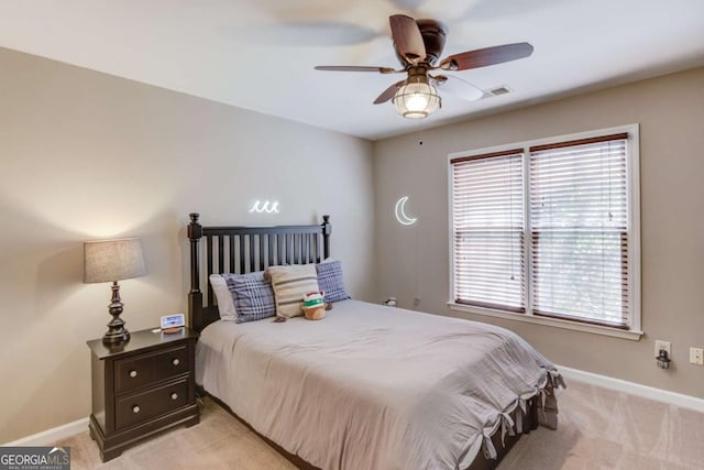 bedroom with light carpet, baseboards, and visible vents