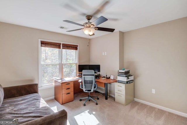 office with light carpet, a ceiling fan, visible vents, and baseboards