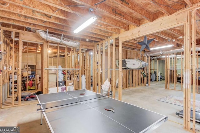 rec room with concrete floors