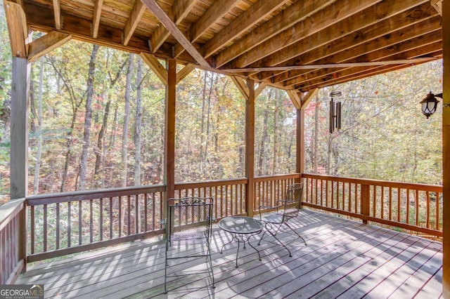 wooden terrace with a forest view