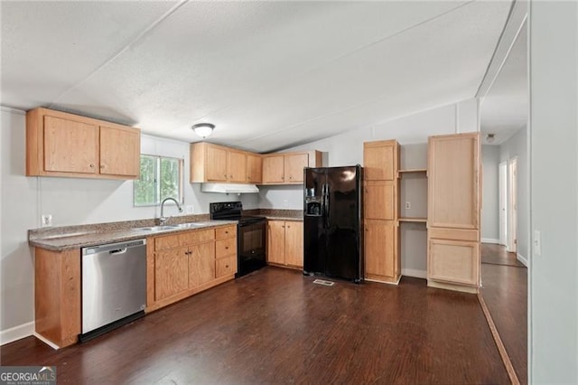kitchen featuring under cabinet range hood, dark wood-style flooring, a sink, and black appliances