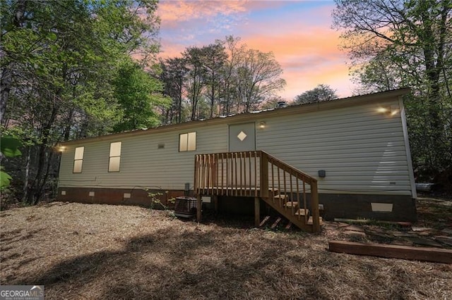 back of house featuring crawl space
