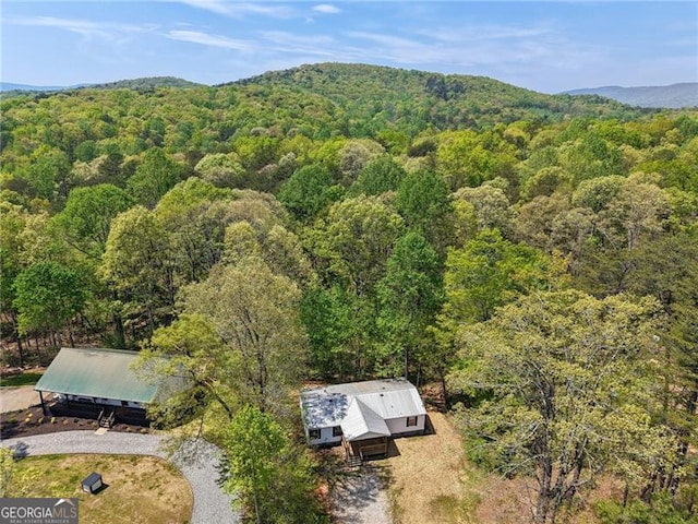 bird's eye view featuring a mountain view and a wooded view