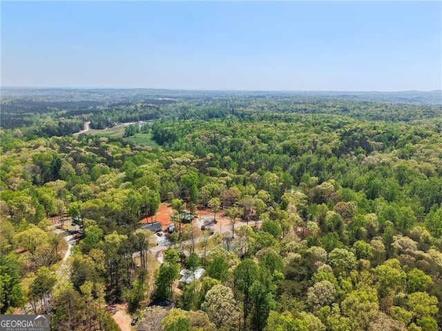 aerial view featuring a view of trees